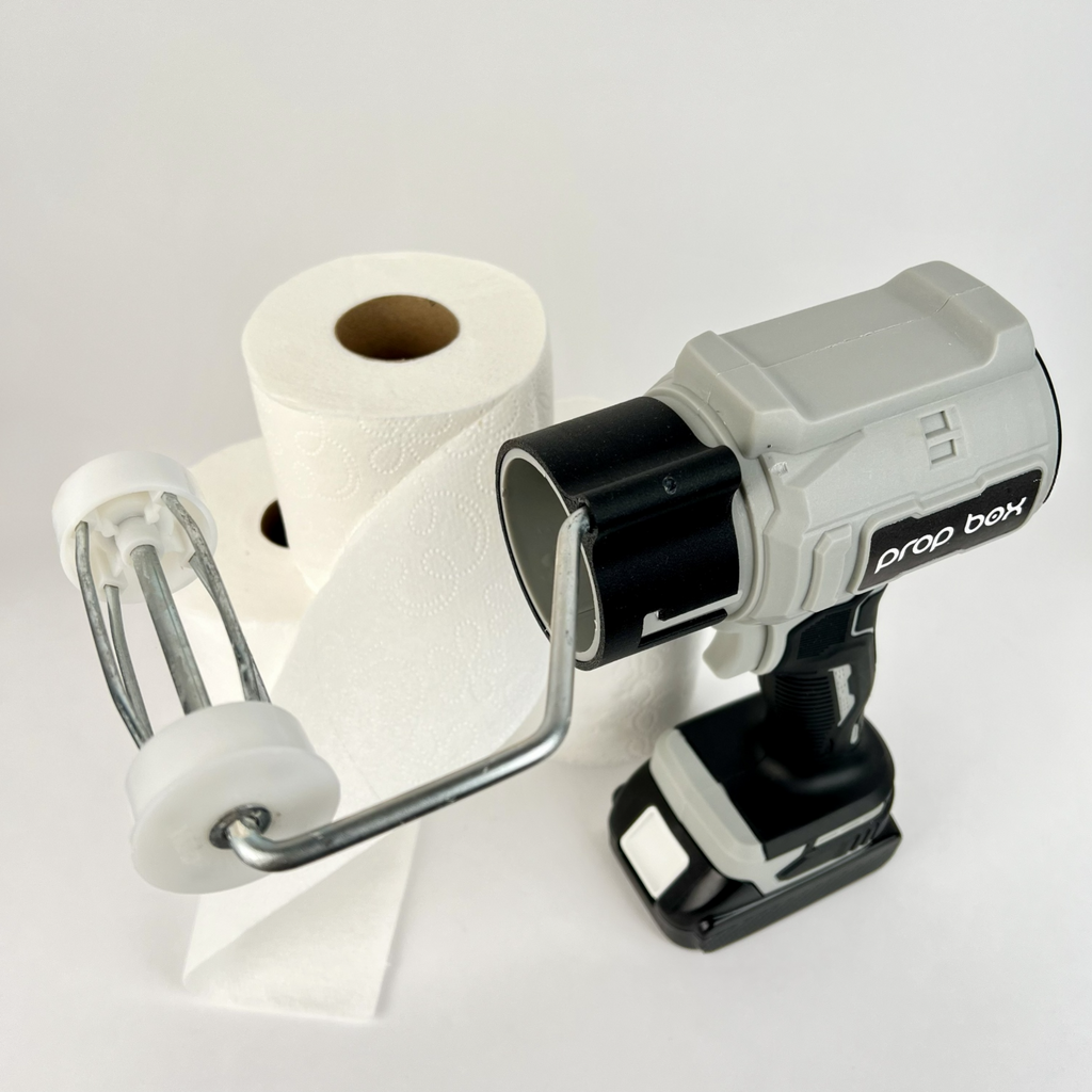 Adjustable roller arm mechanism for holding standard toilet paper rolls