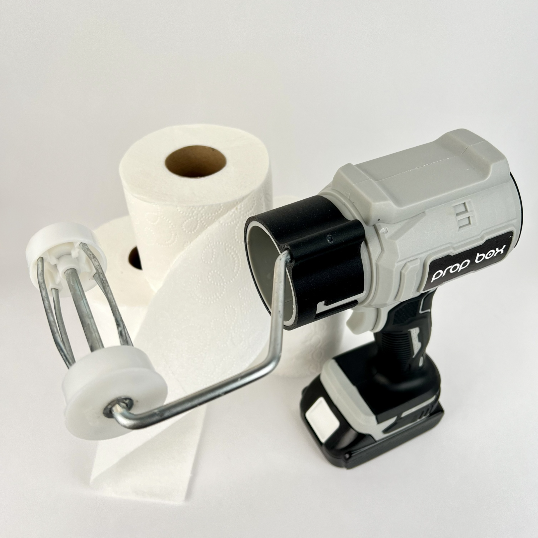 Adjustable roller arm mechanism for holding standard toilet paper rolls