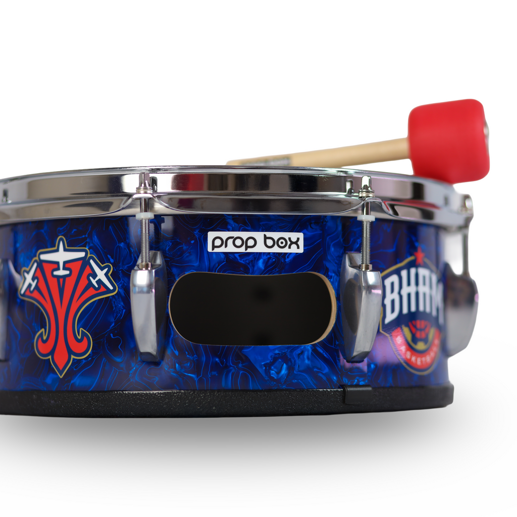 Side view of personalized marching snare drum showing chrome hardware