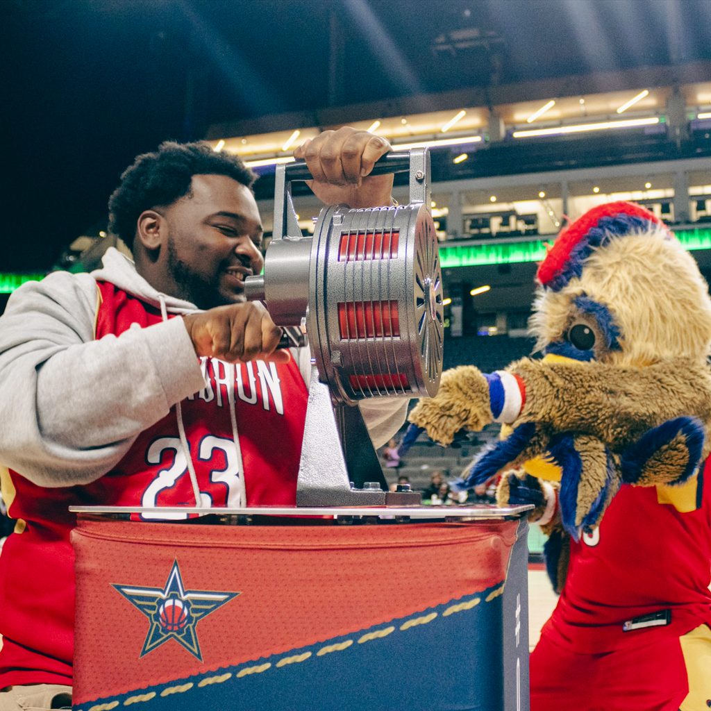 Professional mascot and player using PropBox podium for pre-game ceremony