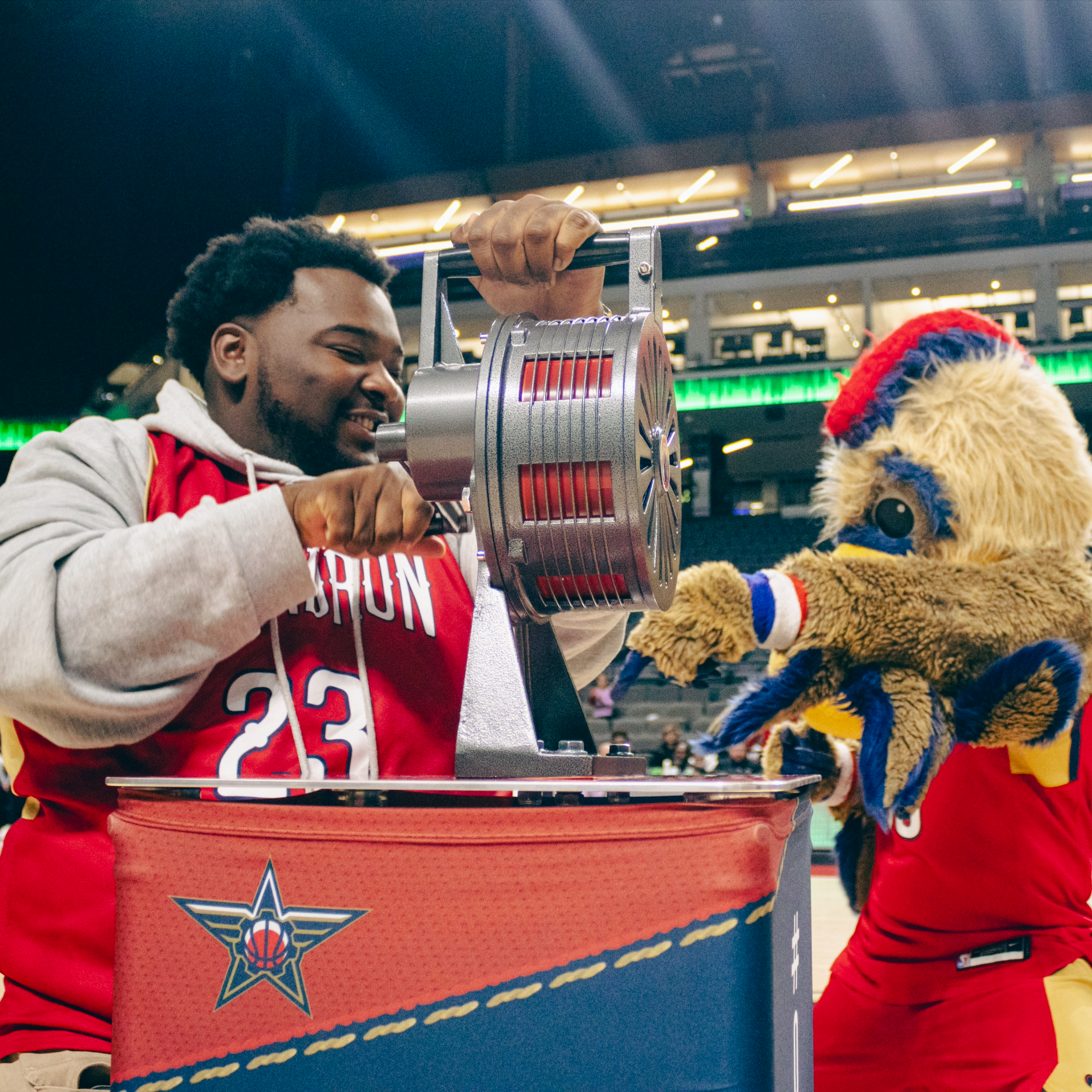 Professional mascot and player using PropBox podium for pre-game ceremony