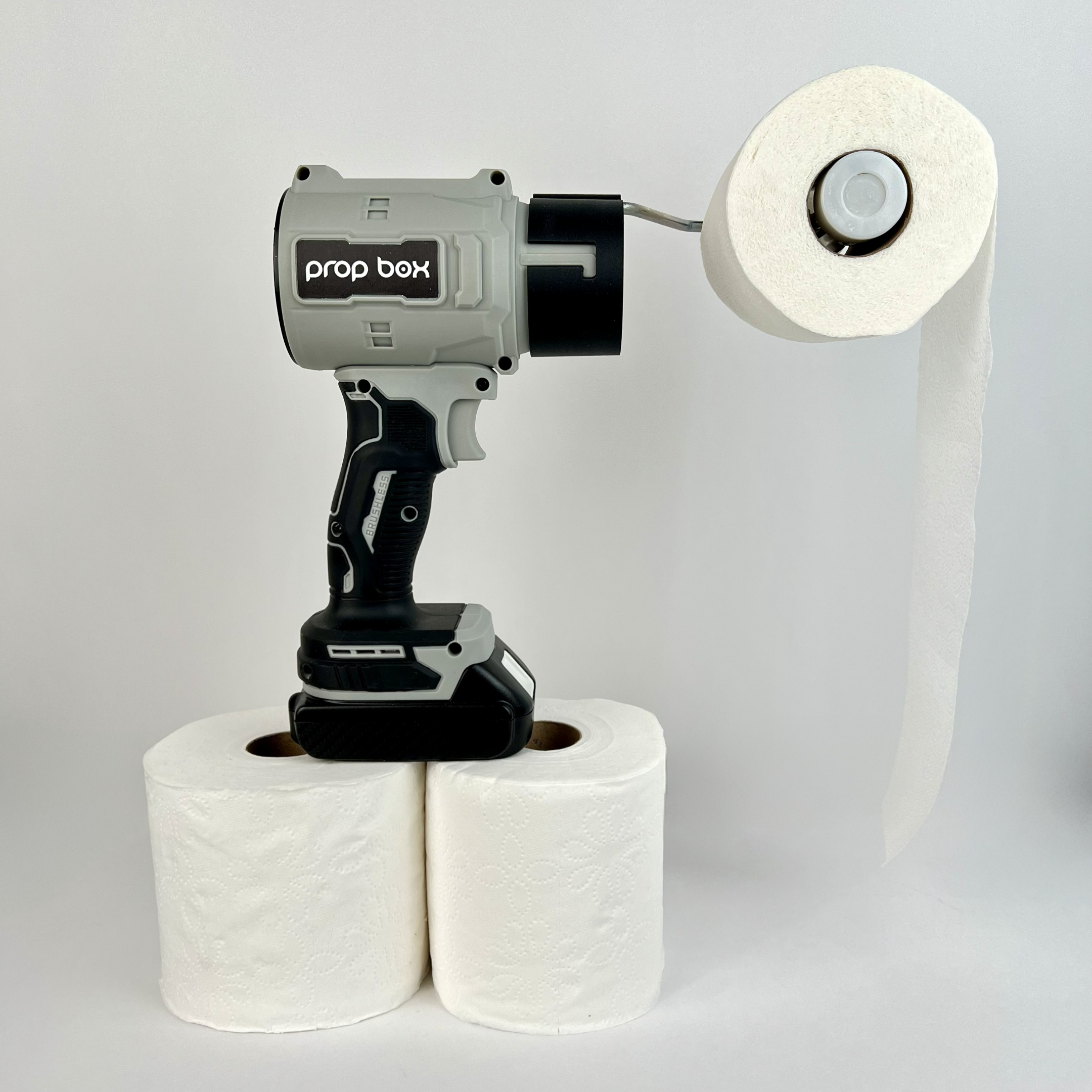 Profile view of PropBox mascot blower prop with toilet paper roll loaded